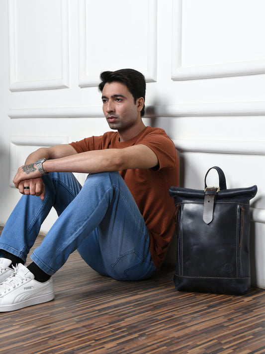 Blue leather bag - lifestyle shot with man sitting, handcrafted buffalo leather | Hema Emporium