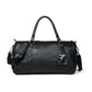 Black Leather Duffle Bag - front view with luggage tag, handcrafted buffalo leather | Hema Emporium