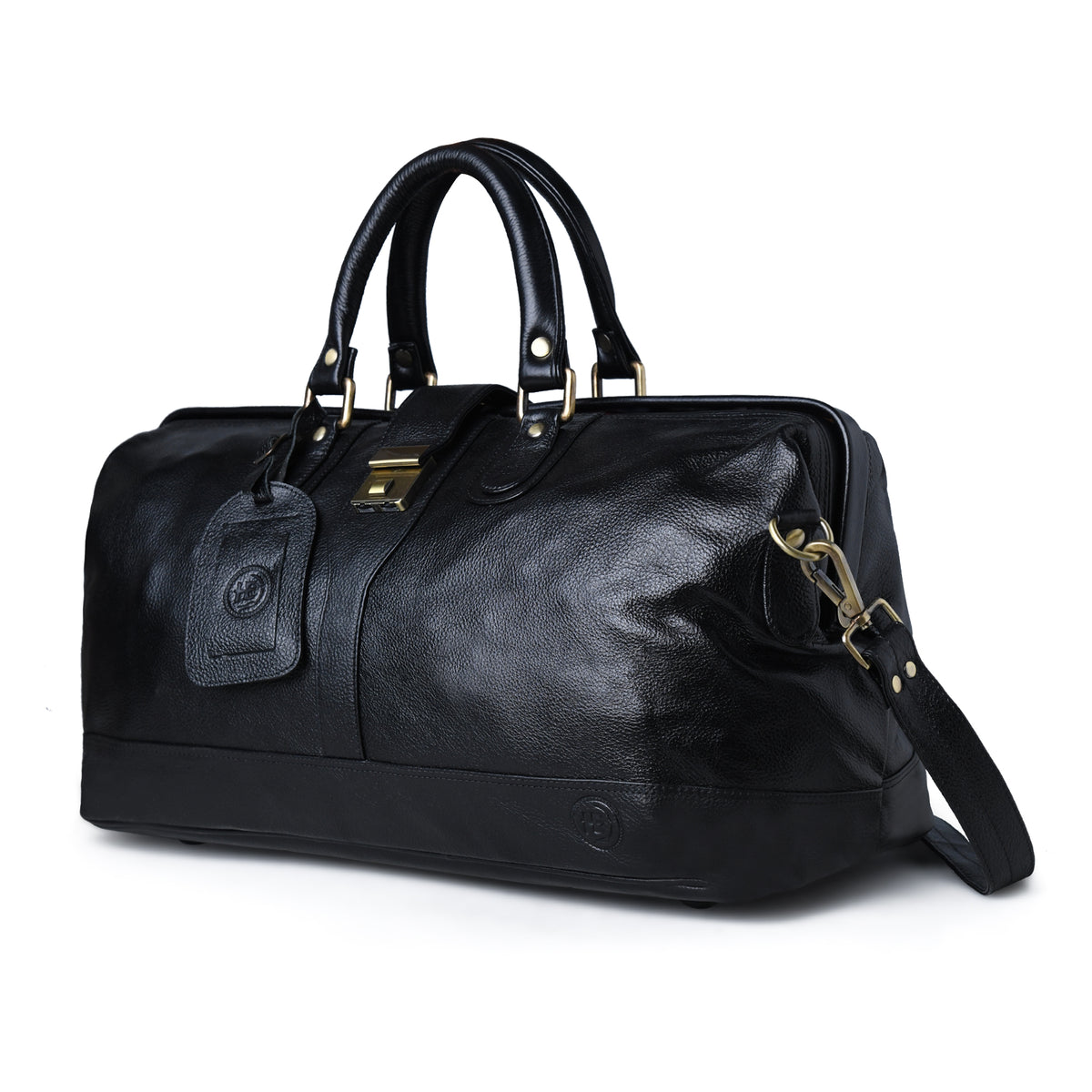 A black leather duffel bag with gold-tone hardware, dual top handles, a detachable shoulder strap, and a hanging leather tag, photographed on a clean white background.