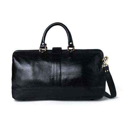 A black leather duffel bag with dual top handles and a detachable shoulder strap, shown against a plain white background.