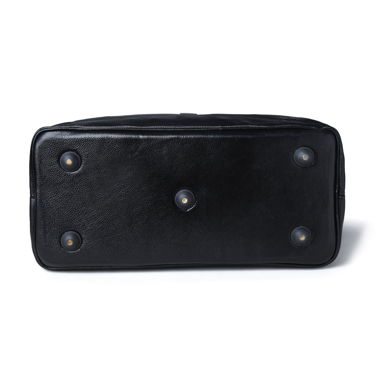  black leather bag, showing four circular metal feet with small gold-colored centers, set against a plain white background.