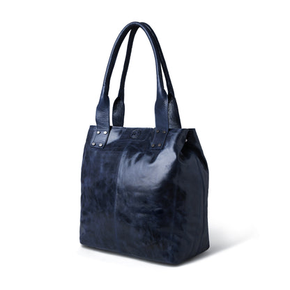 A dark navy leather tote bag with dual top handles and silver-tone hardware, photographed on a clean white background.