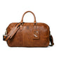 Brown Leather Duffle Bag - front view with dual handles and shoulder strap, handcrafted buffalo leather | Hema Emporium