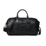 Black Leather Duffle Bag - front view with top handles, shoulder strap, brass hardware, and luggage tag, handcrafted buffalo leather | Hema Emporium