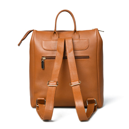 tan Brown leather backpack shown from the back, featuring dual top handles, a zippered front pocket, and adjustable shoulder straps with hardware, set against a plain white background.