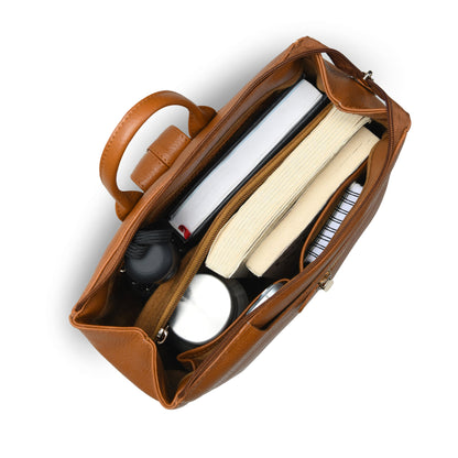 tan Brown  leather organizer bag shown from an overhead angle, filled with notebooks, a spiral notebook, and small accessories, on a plain white background.
