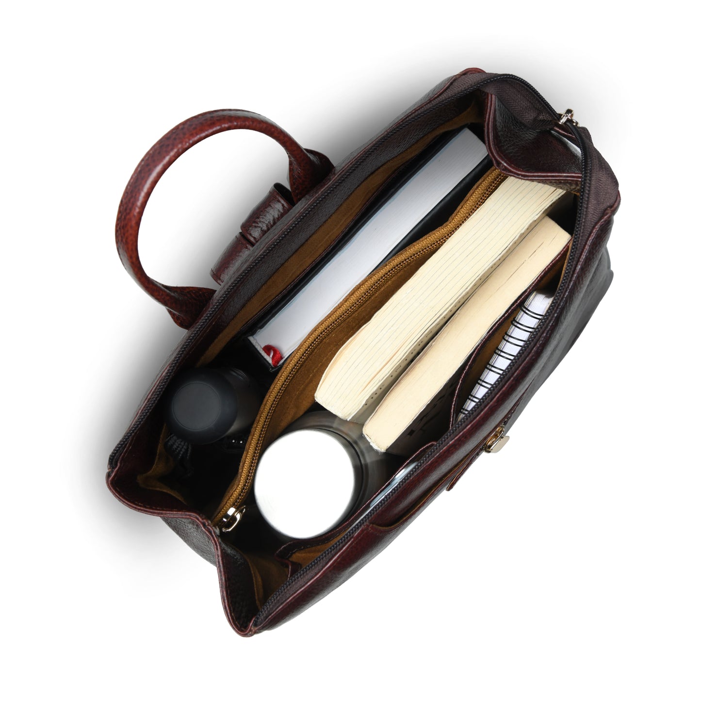 burgundy leather handbag shown from a top-down angle, open to reveal its interior compartments filled with books, a notebook, and small accessories, on a white background.