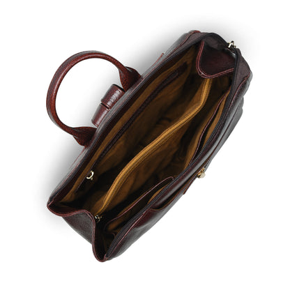 burgundy leather handbag shown from a top-down angle, revealing a tan interior with a central zippered pocket and  hardware.