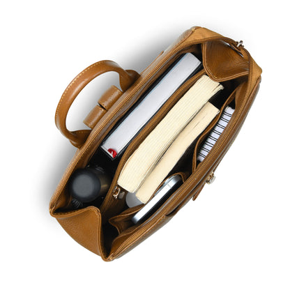 Gold leather laptop bag shown from a top-down view, open to display its interior compartments filled with books, a notebook, and a laptop, on a white background.